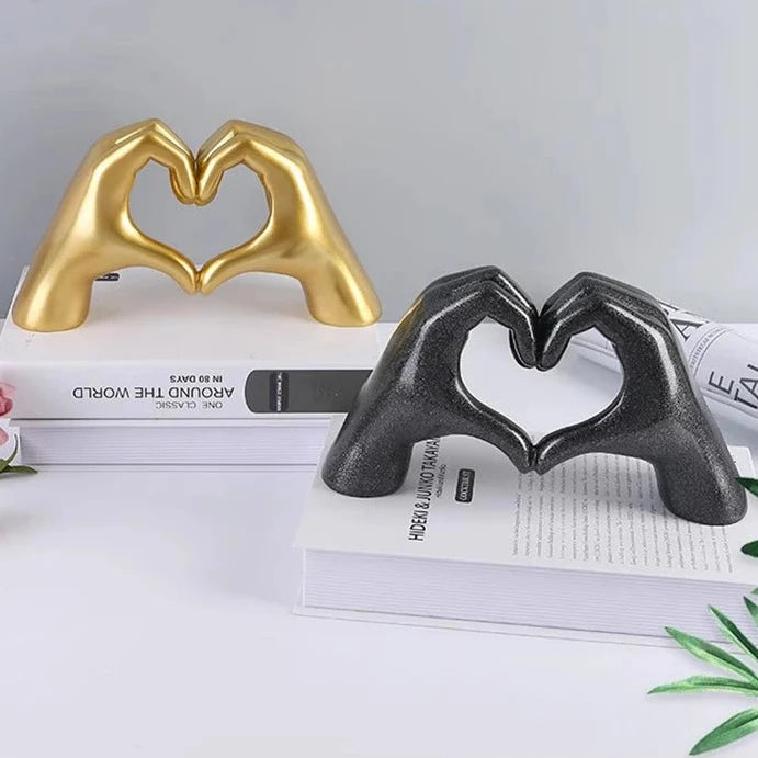 Heart hand statue